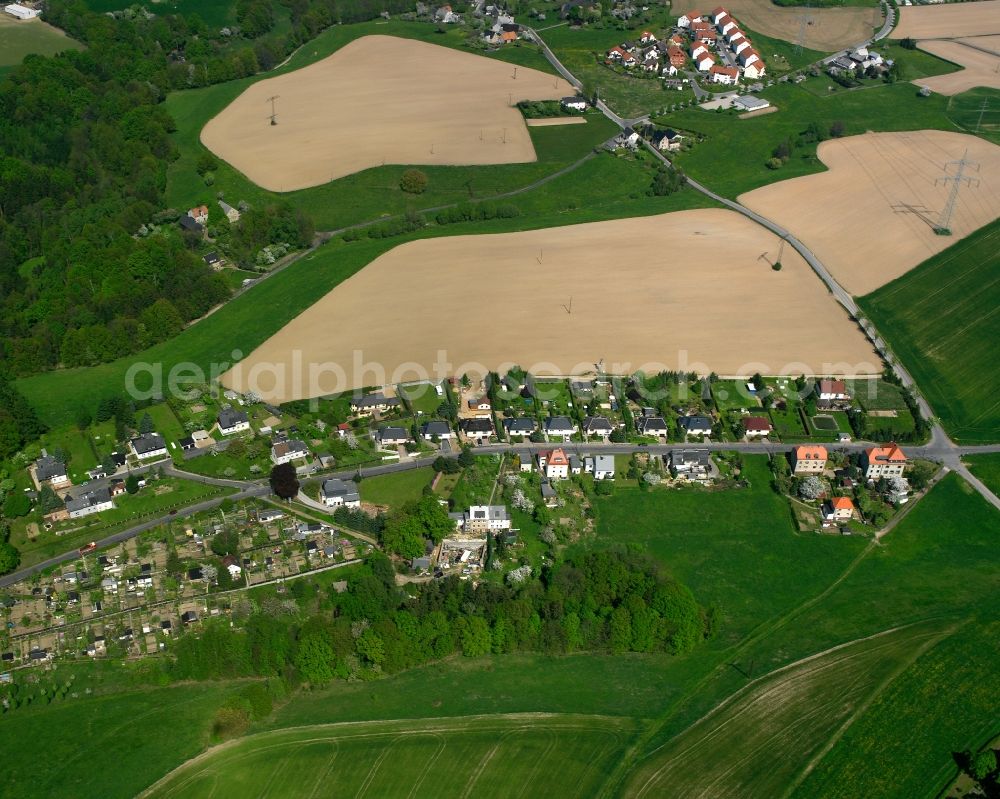 Aerial image Schönborn-Dreiwerden - Agricultural land and field boundaries surround the settlement area of the village in Schönborn-Dreiwerden in the state Saxony, Germany