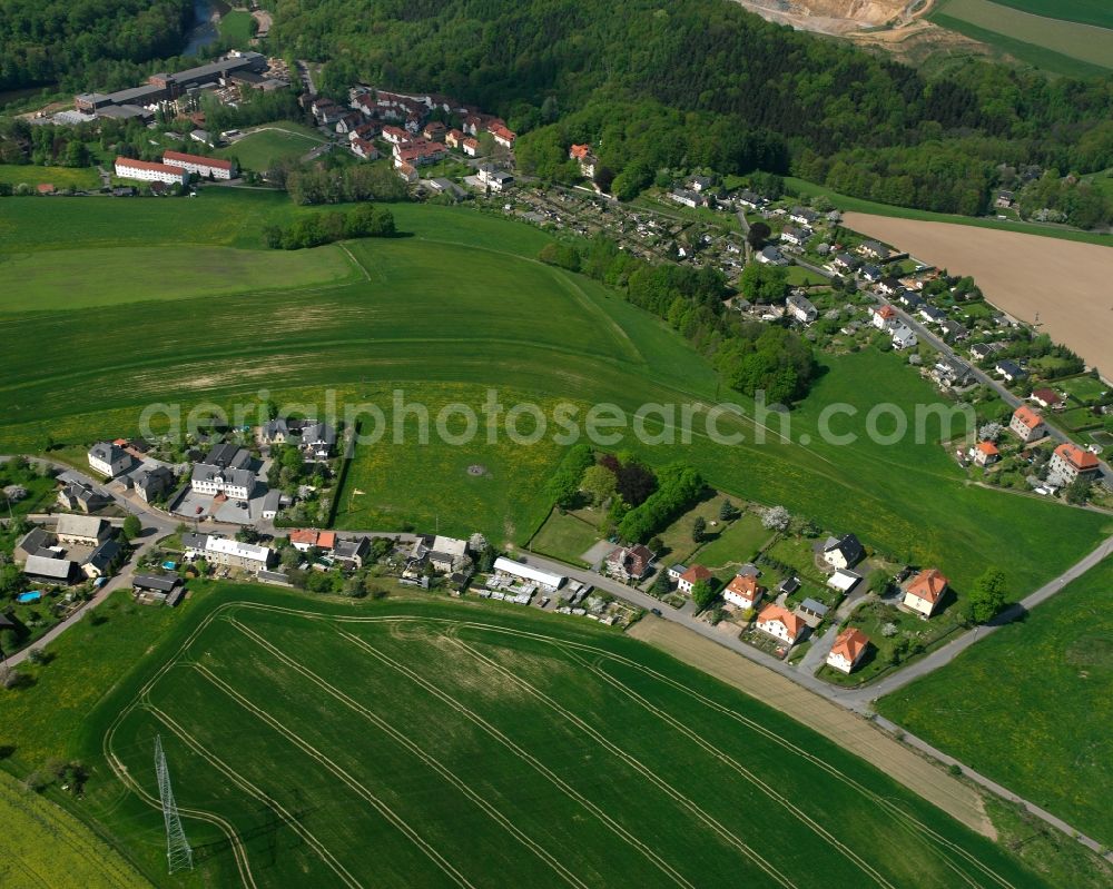 Aerial image Schönborn-Dreiwerden - Agricultural land and field boundaries surround the settlement area of the village in Schönborn-Dreiwerden in the state Saxony, Germany