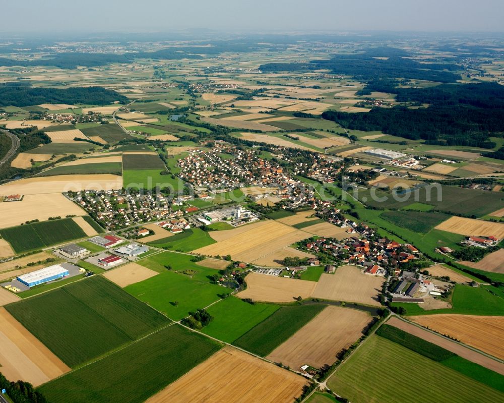 Schnelldorf from the bird's eye view: Agricultural land and field boundaries surround the settlement area of the village in Schnelldorf in the state Bavaria, Germany