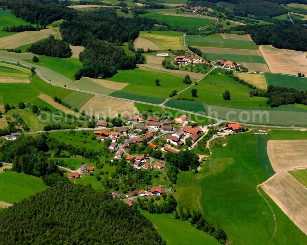 Aerial photograph Schönstein - Agricultural land and field boundaries surround the settlement area of the village in Schönstein in the state Bavaria, Germany