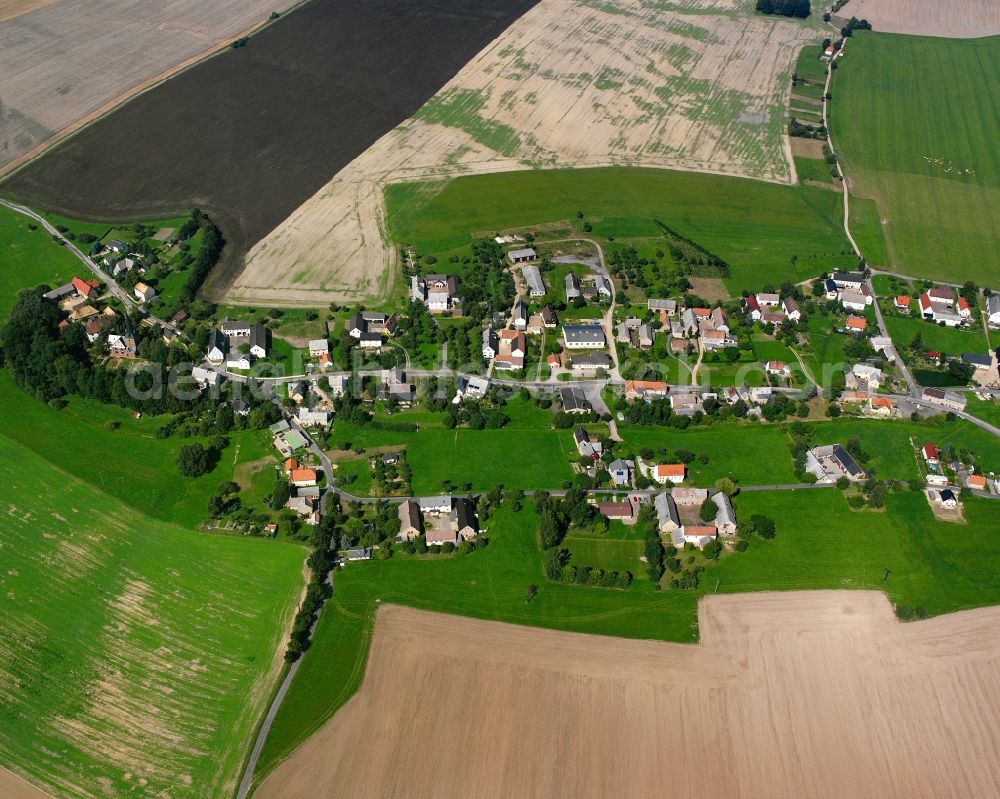 Schwarzbach from the bird's eye view: Agricultural land and field boundaries surround the settlement area of the village in Schwarzbach in the state Saxony, Germany