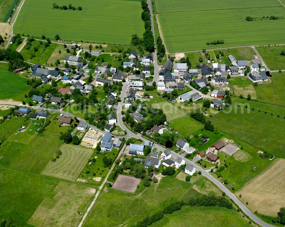 Schwarzen from the bird's eye view: Agricultural land and field boundaries surround the settlement area of the village in Schwarzen in the state Rhineland-Palatinate, Germany