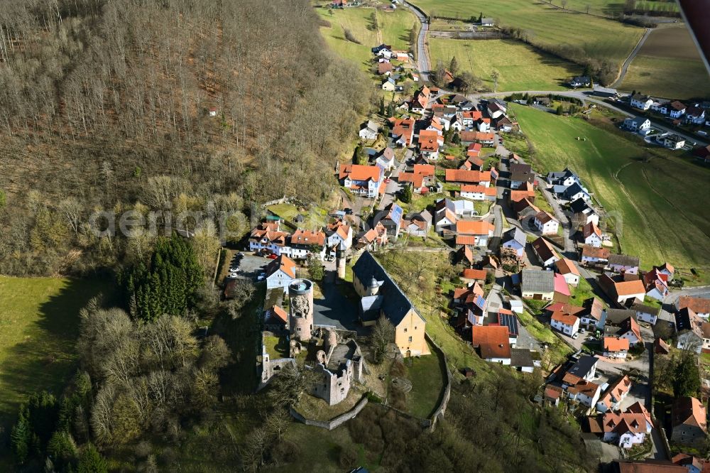 Schwarzenfels from the bird's eye view: Agricultural land and field boundaries surround the settlement area of the village in Schwarzenfels in the state Hesse, Germany