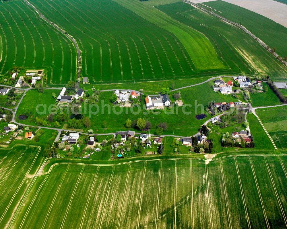 Aerial image Schweikershain - Agricultural land and field boundaries surround the settlement area of the village in Schweikershain in the state Saxony, Germany