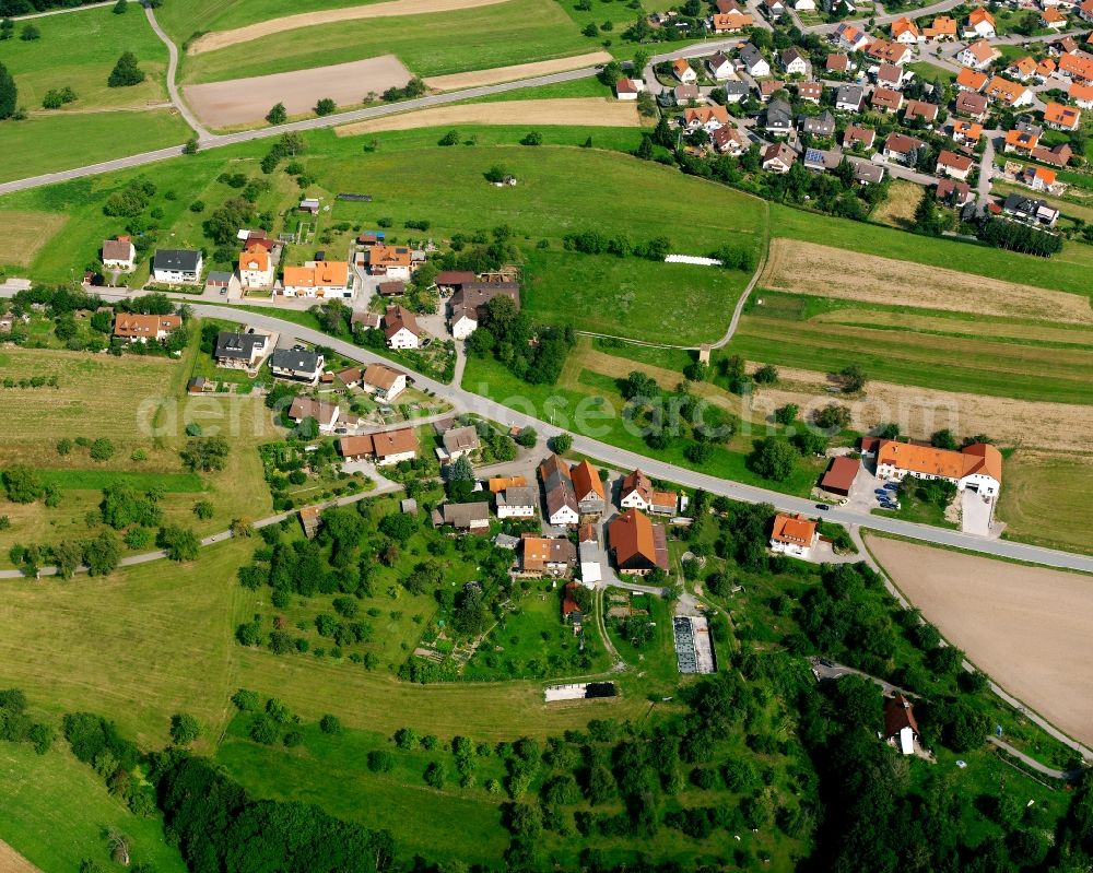 Schweizerhof from above - Agricultural land and field boundaries surround the settlement area of the village in Schweizerhof in the state Baden-Wuerttemberg, Germany