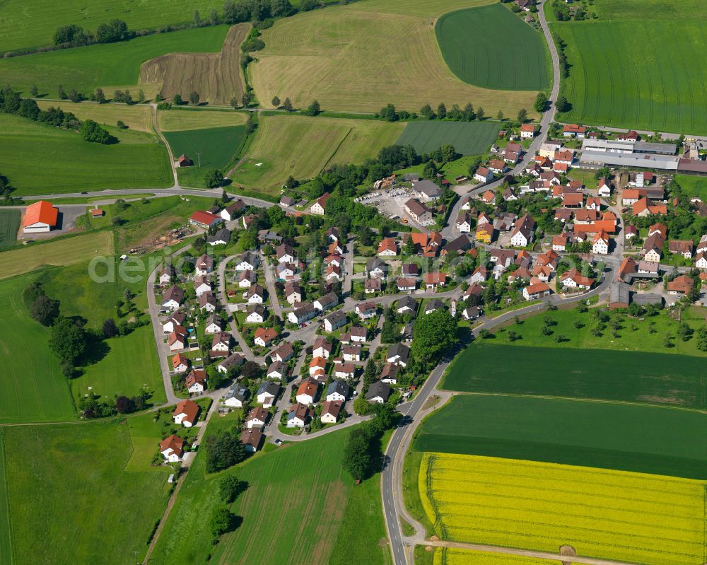 Schwendi from the bird's eye view: Agricultural land and field boundaries surround the settlement area of the village in Schwendi in the state Baden-Wuerttemberg, Germany