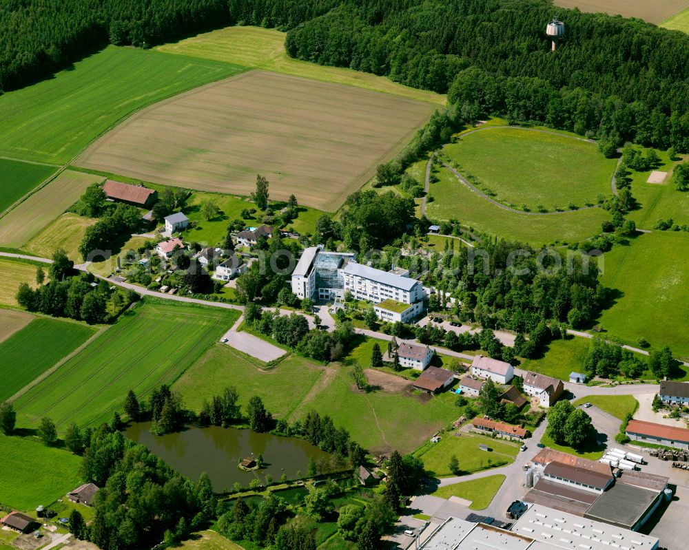 Schwendi from the bird's eye view: Agricultural land and field boundaries surround the settlement area of the village in Schwendi in the state Baden-Wuerttemberg, Germany