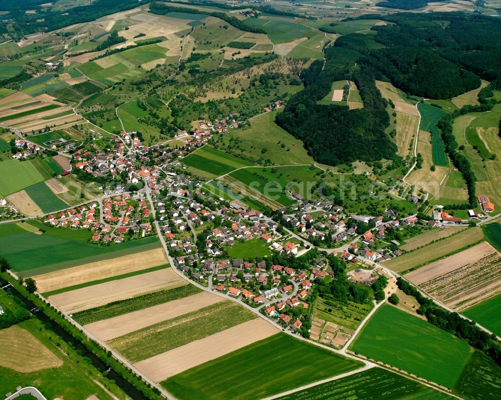 Schwerzen from above - Agricultural land and field boundaries surround the settlement area of the village in Schwerzen in the state Baden-Wuerttemberg, Germany