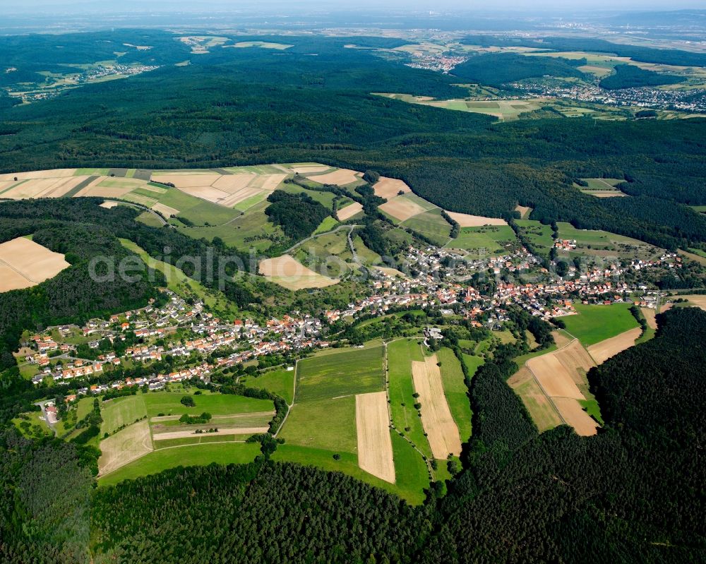 Aerial photograph Seckmauern - Agricultural land and field boundaries surround the settlement area of the village in Seckmauern in the state Hesse, Germany