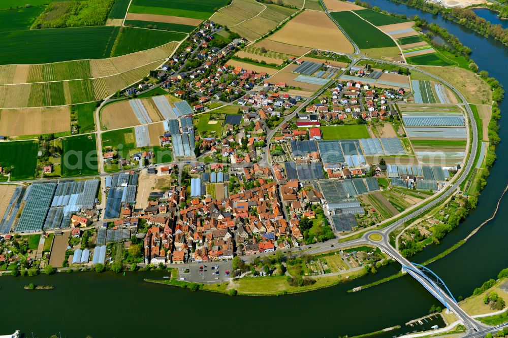 Aerial photograph Segnitz - Agricultural land and field boundaries surround the settlement area of the village in Segnitz in the state Bavaria, Germany