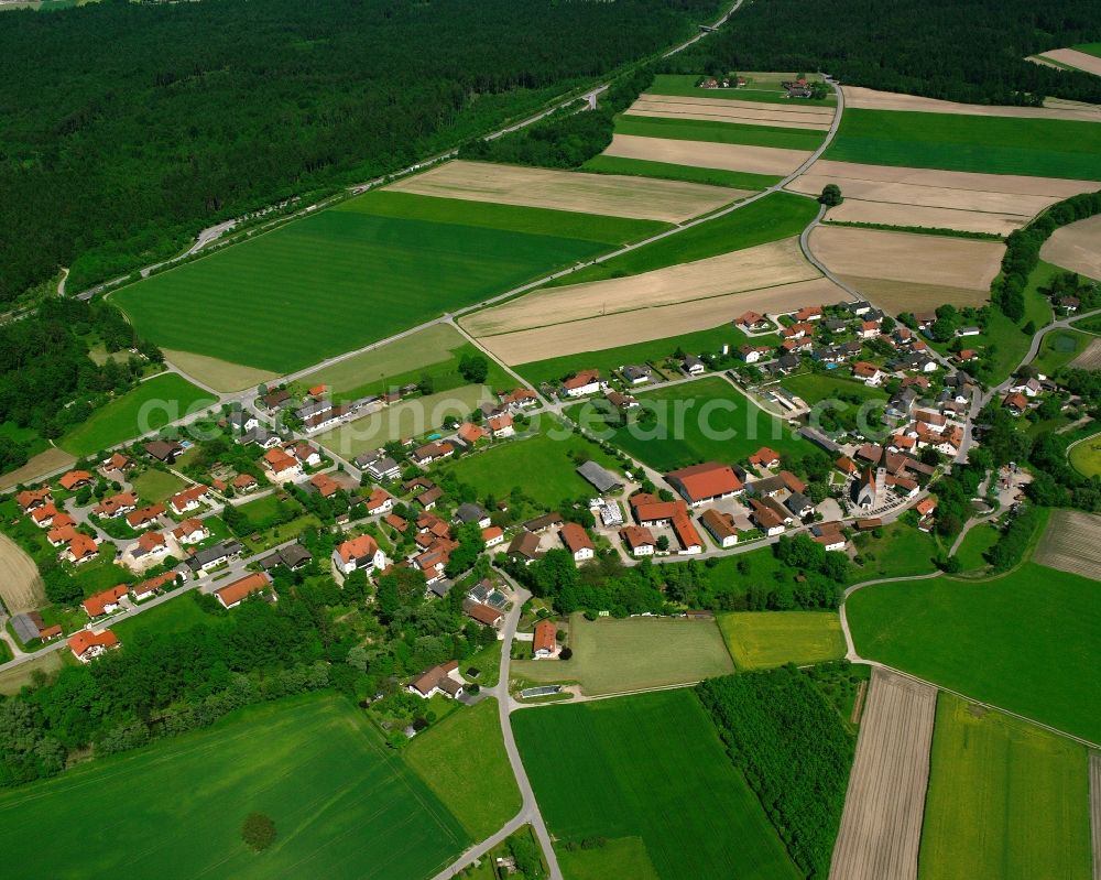 Seibersdorf from above - Agricultural land and field boundaries surround the settlement area of the village in Seibersdorf in the state Bavaria, Germany