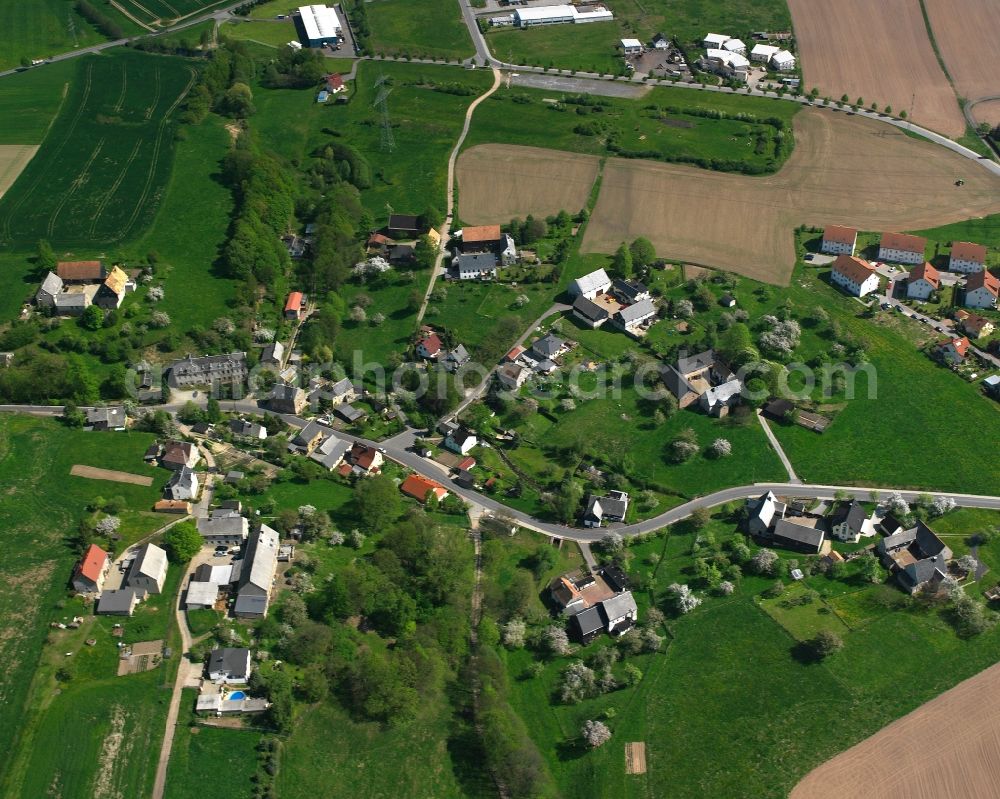 Seifersbach from above - Agricultural land and field boundaries surround the settlement area of the village in Seifersbach in the state Saxony, Germany