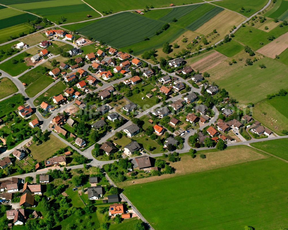 Seitzental from above - Agricultural land and field boundaries surround the settlement area of the village in Seitzental in the state Baden-Wuerttemberg, Germany