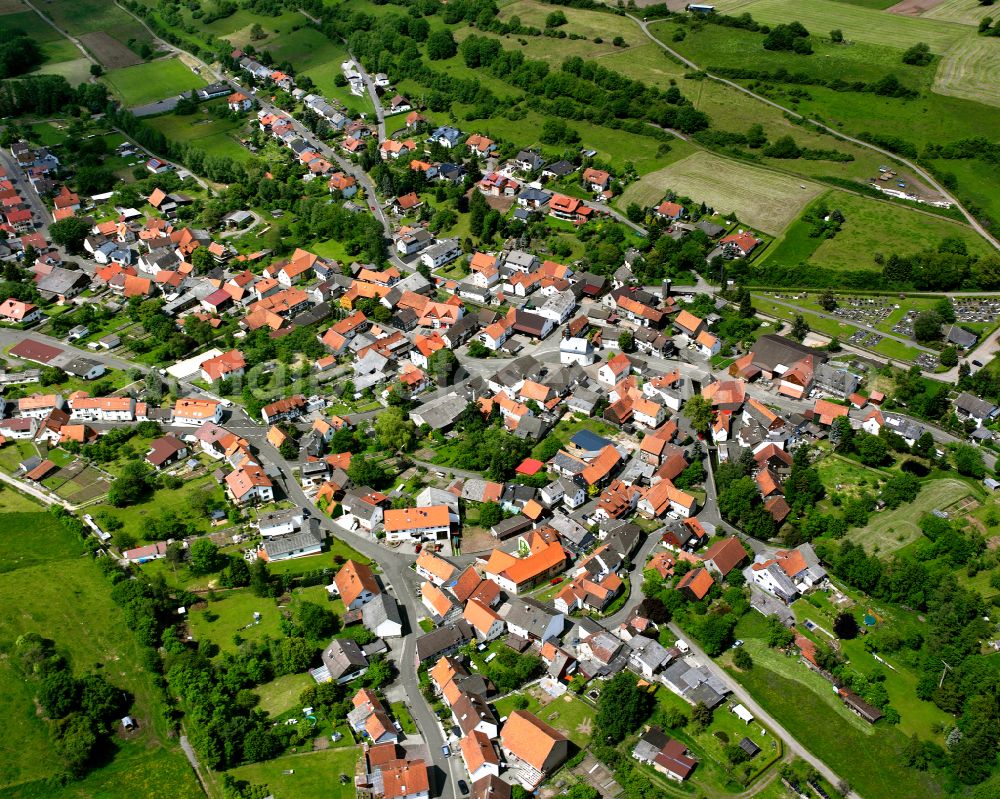 Aerial image Sellnrod - Agricultural land and field boundaries surround the settlement area of the village in Sellnrod in the state Hesse, Germany