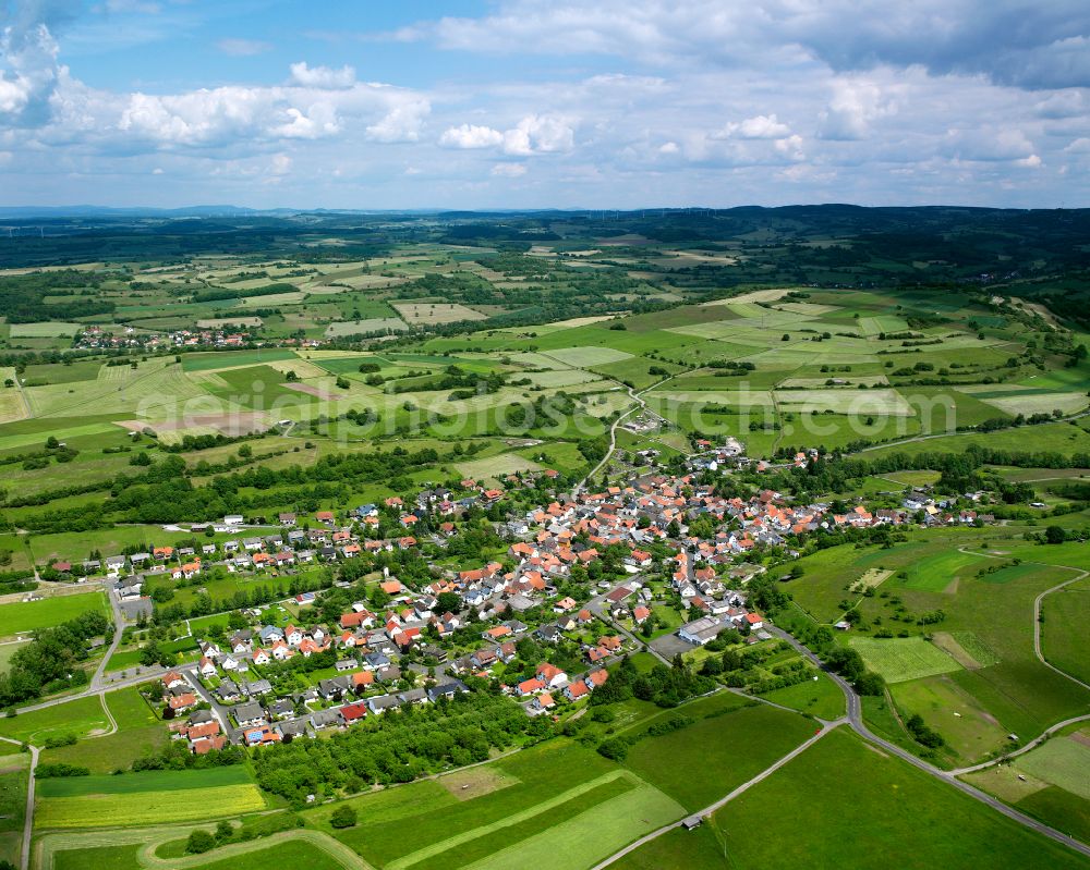 Sellnrod from above - Agricultural land and field boundaries surround the settlement area of the village in Sellnrod in the state Hesse, Germany