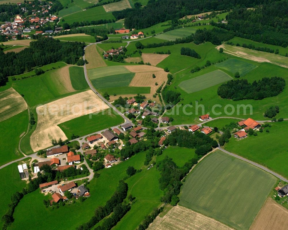 Semmersdorf from above - Agricultural land and field boundaries surround the settlement area of the village in Semmersdorf in the state Bavaria, Germany