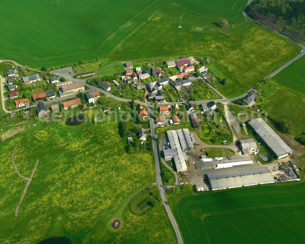 Silberfeld from the bird's eye view: Agricultural land and field boundaries surround the settlement area of the village in Silberfeld in the state Thuringia, Germany