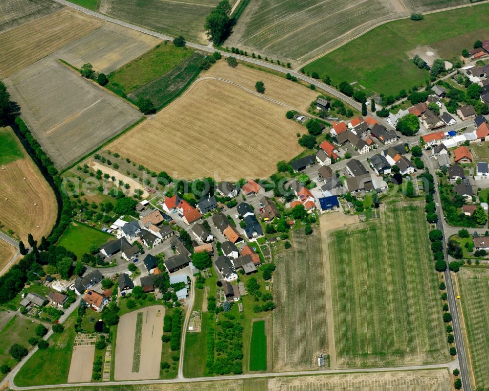 Sinzheim from above - Agricultural land and field boundaries surround the settlement area of the village in Sinzheim in the state Baden-Wuerttemberg, Germany