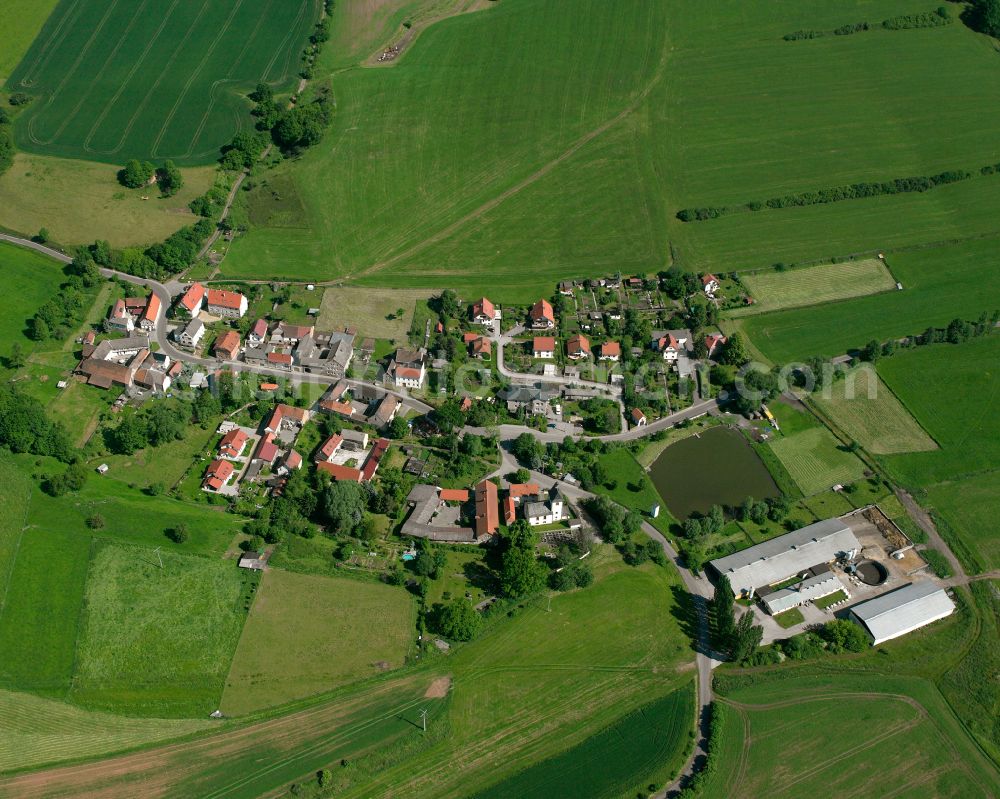 Sirbis from the bird's eye view: Agricultural land and field boundaries surround the settlement area of the village in Sirbis in the state Thuringia, Germany