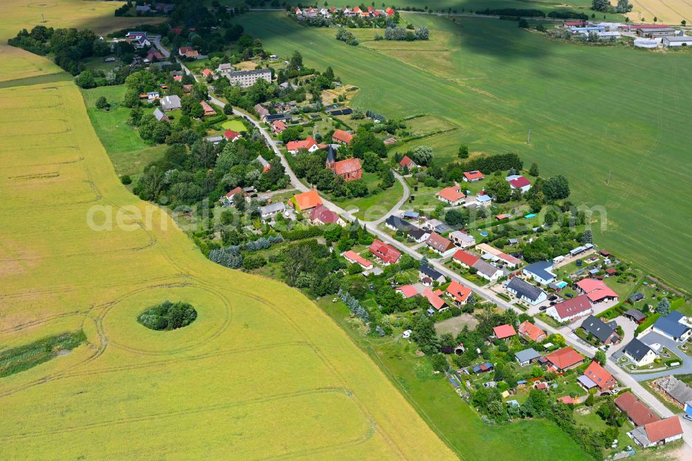 Aerial image Sülten - Agricultural land and field boundaries surround the settlement area of the village in Sülten in the state Mecklenburg - Western Pomerania, Germany