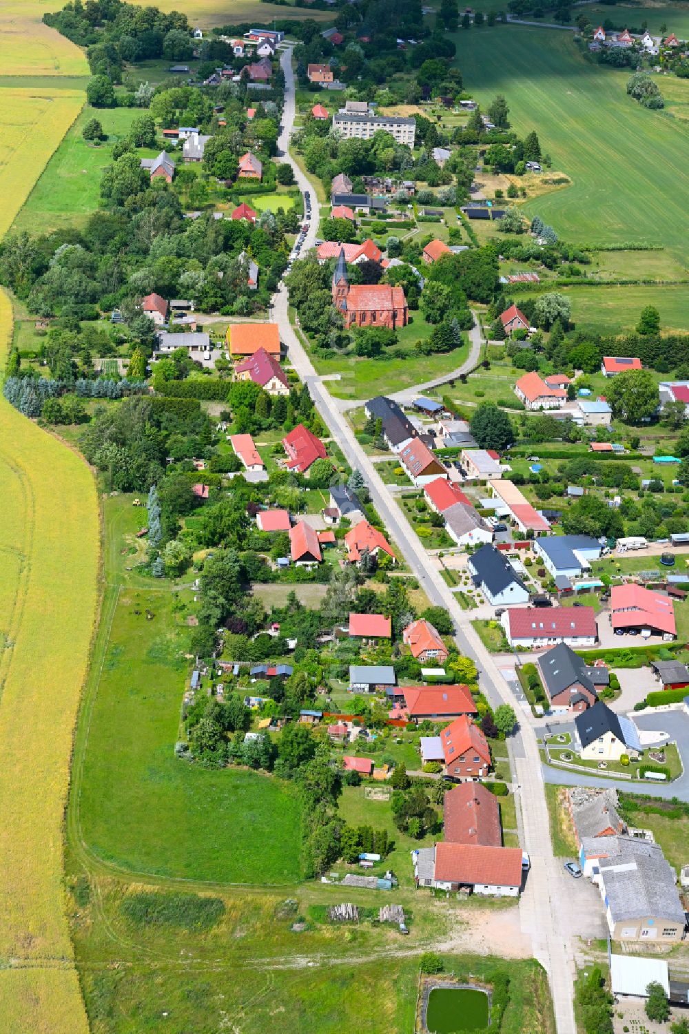 Aerial photograph Sülten - Agricultural land and field boundaries surround the settlement area of the village in Sülten in the state Mecklenburg - Western Pomerania, Germany