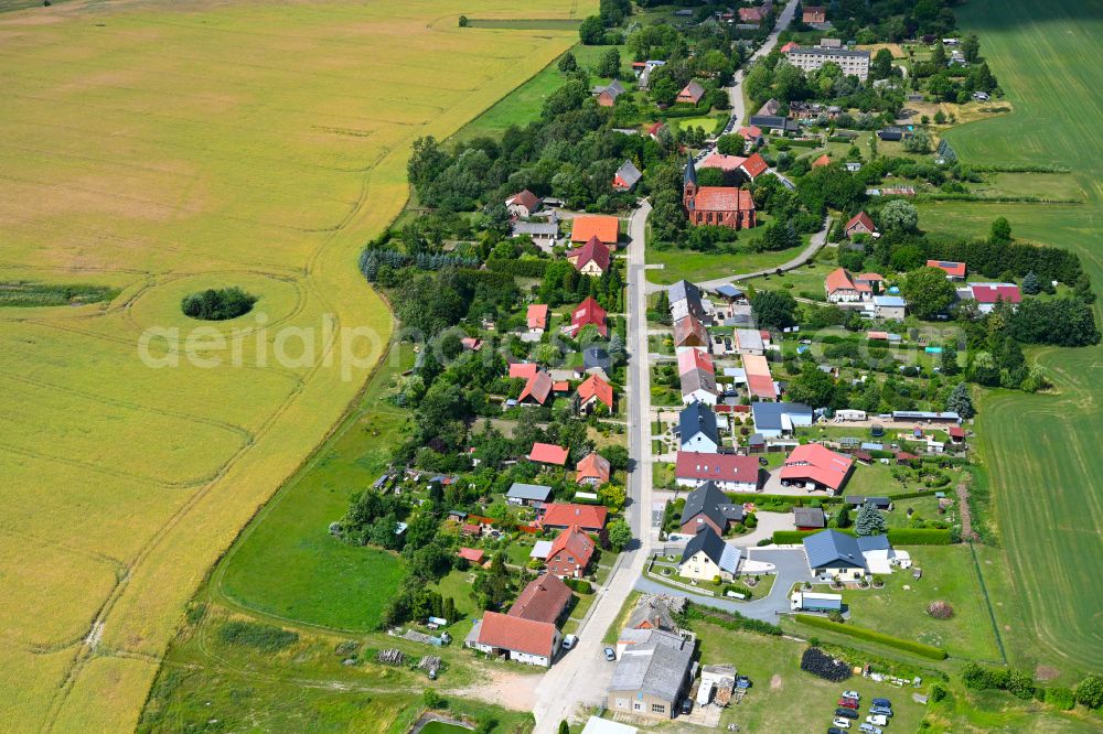 Sülten from above - Agricultural land and field boundaries surround the settlement area of the village in Sülten in the state Mecklenburg - Western Pomerania, Germany