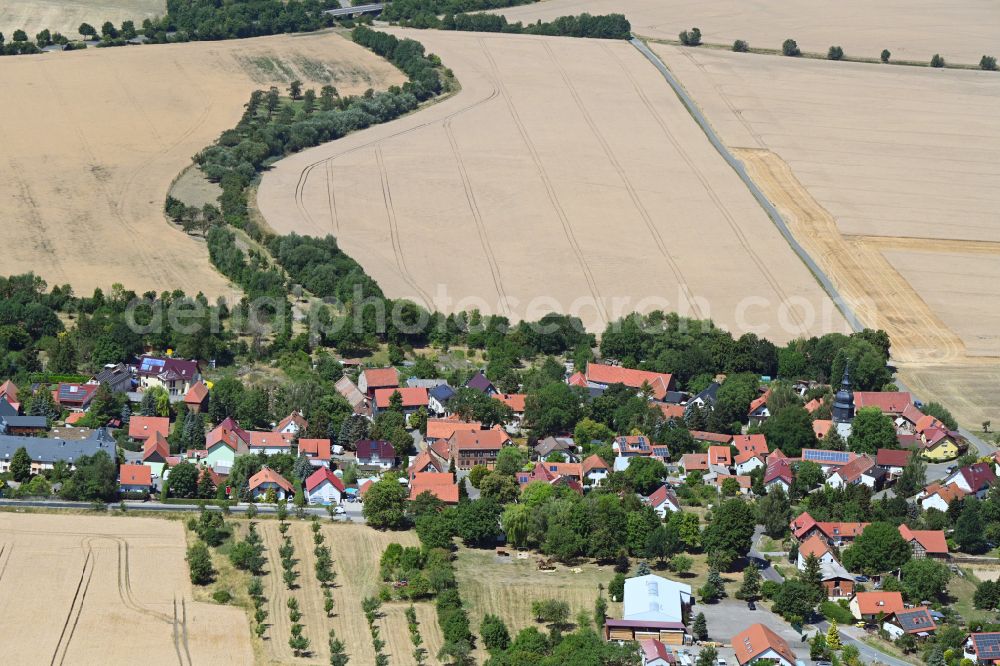 Aerial photograph Sohnstedt - Agricultural land and field boundaries surround the settlement area of the village in Sohnstedt in the state Thuringia, Germany