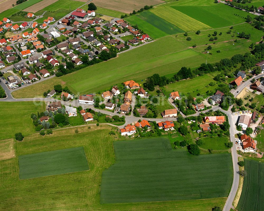 Sommenhardt from above - Agricultural land and field boundaries surround the settlement area of the village in Sommenhardt in the state Baden-Wuerttemberg, Germany