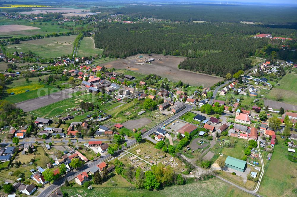 Aerial image Sommerfeld - Agricultural land and field boundaries surround the settlement area of the village in Sommerfeld in the state Brandenburg, Germany