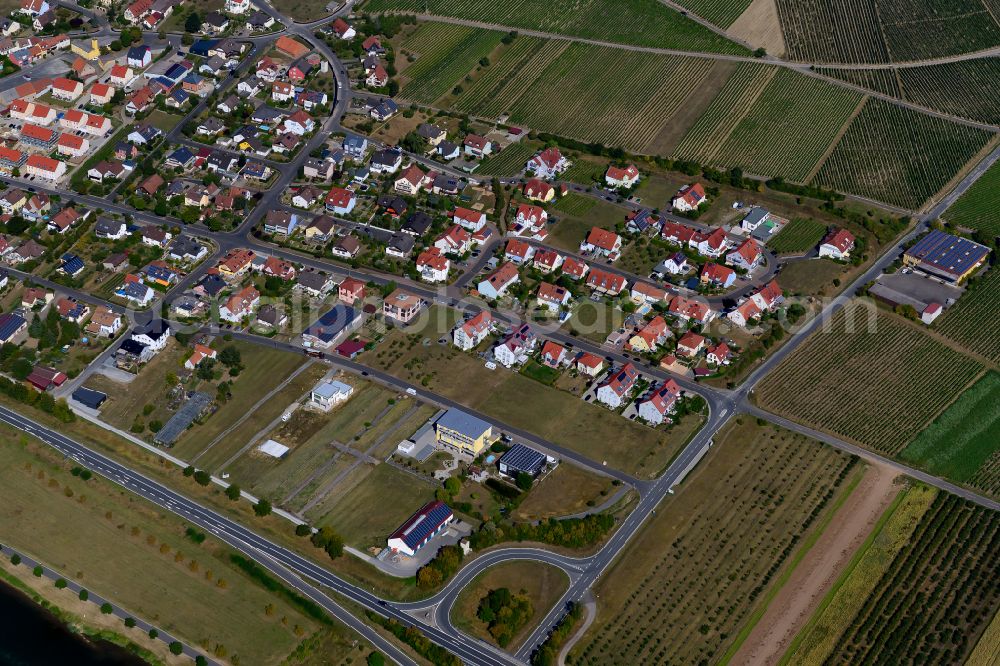 Sommerhausen from above - Agricultural land and field boundaries surround the settlement area of the village in Sommerhausen in the state Bavaria, Germany