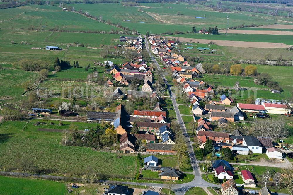 Aerial image Sonnenberg - Agricultural land and field boundaries surround the settlement area of the village in Sonnenberg in the state Brandenburg, Germany