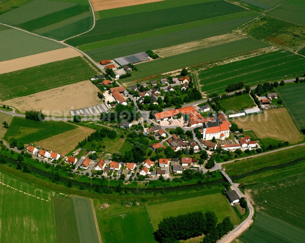 Sossau from above - Agricultural land and field boundaries surround the settlement area of the village in Sossau in the state Bavaria, Germany