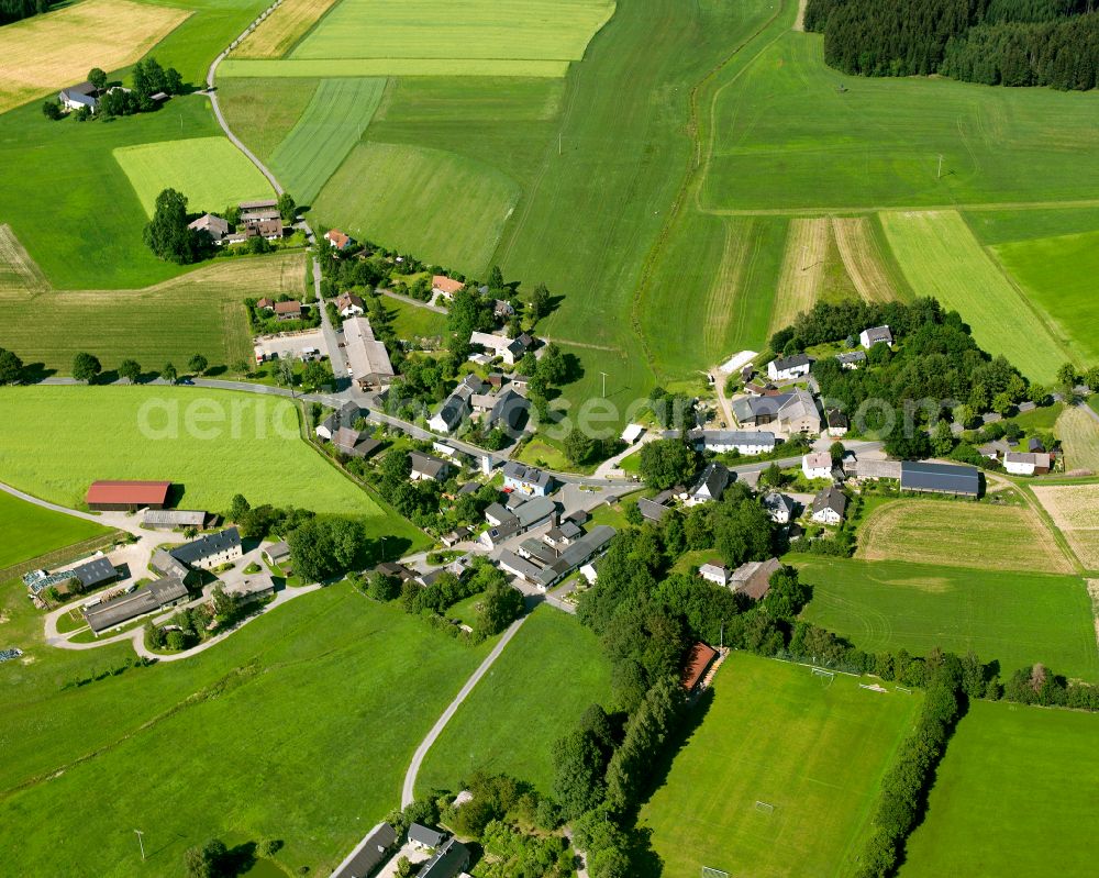 Sparneck from above - Agricultural land and field boundaries surround the settlement area of the village on street Stockenroth in the district Germersreuth in Sparneck in the state Bavaria, Germany