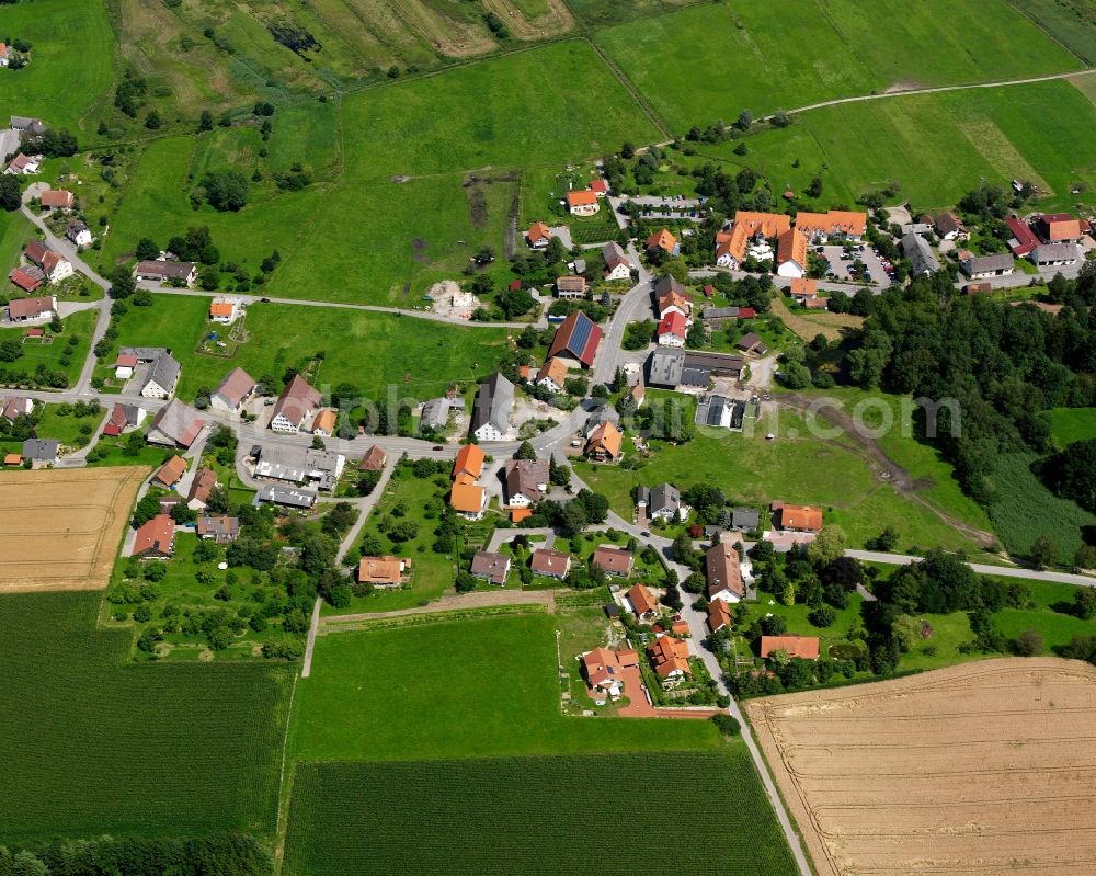 Spöck from above - Agricultural land and field boundaries surround the settlement area of the village in Spöck in the state Baden-Wuerttemberg, Germany