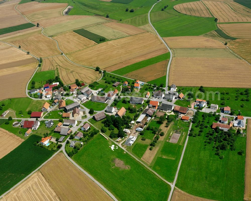 Spöck from above - Agricultural land and field boundaries surround the settlement area of the village in Spöck in the state Baden-Wuerttemberg, Germany