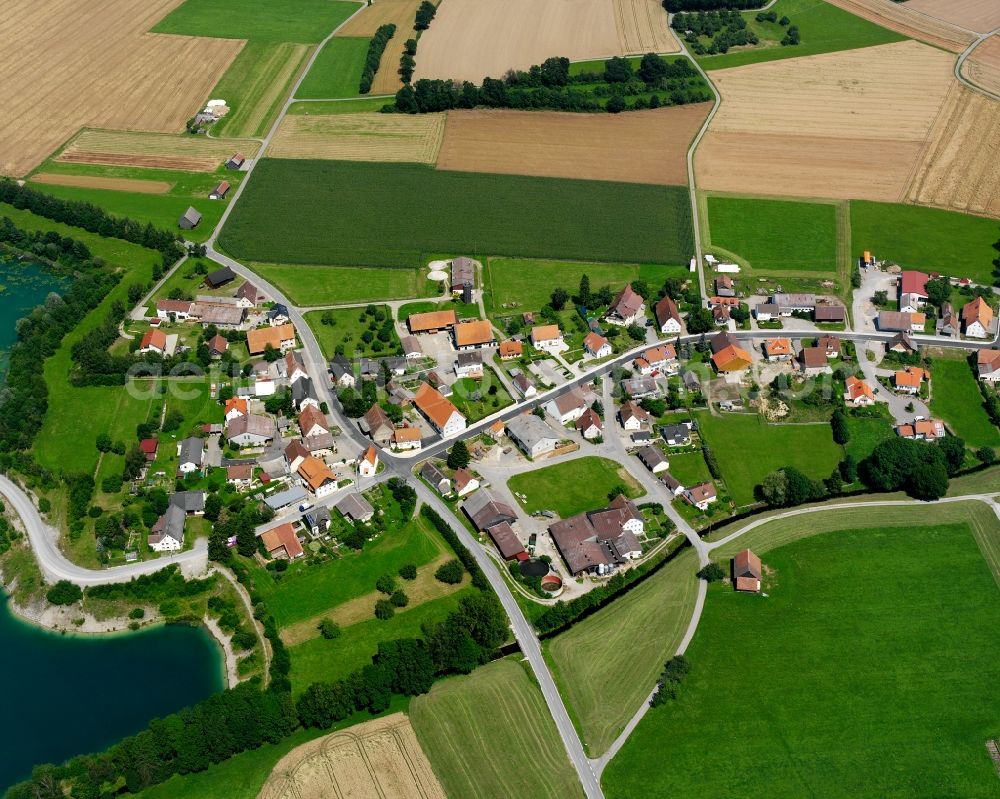 Spöck from above - Agricultural land and field boundaries surround the settlement area of the village in Spöck in the state Baden-Wuerttemberg, Germany