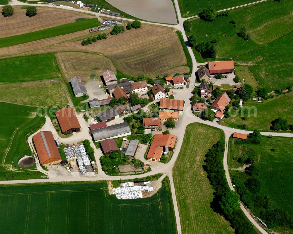 Spielberg from above - Agricultural land and field boundaries surround the settlement area of the village in Spielberg in the state Bavaria, Germany