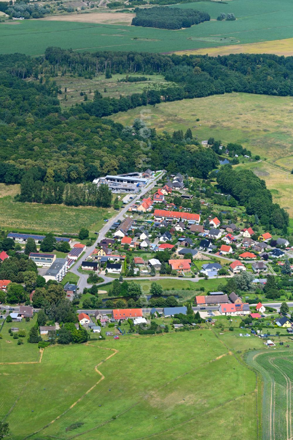 Sponholz from the bird's eye view: Agricultural land and field boundaries surround the settlement area of the village in Sponholz in the state Mecklenburg - Western Pomerania, Germany