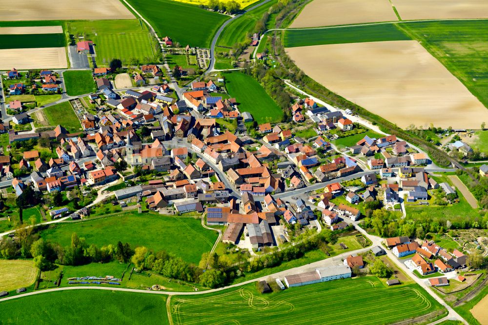 Aerial image Stadelschwarzach - Agricultural land and field boundaries surround the settlement area of the village in Stadelschwarzach in the state Bavaria, Germany