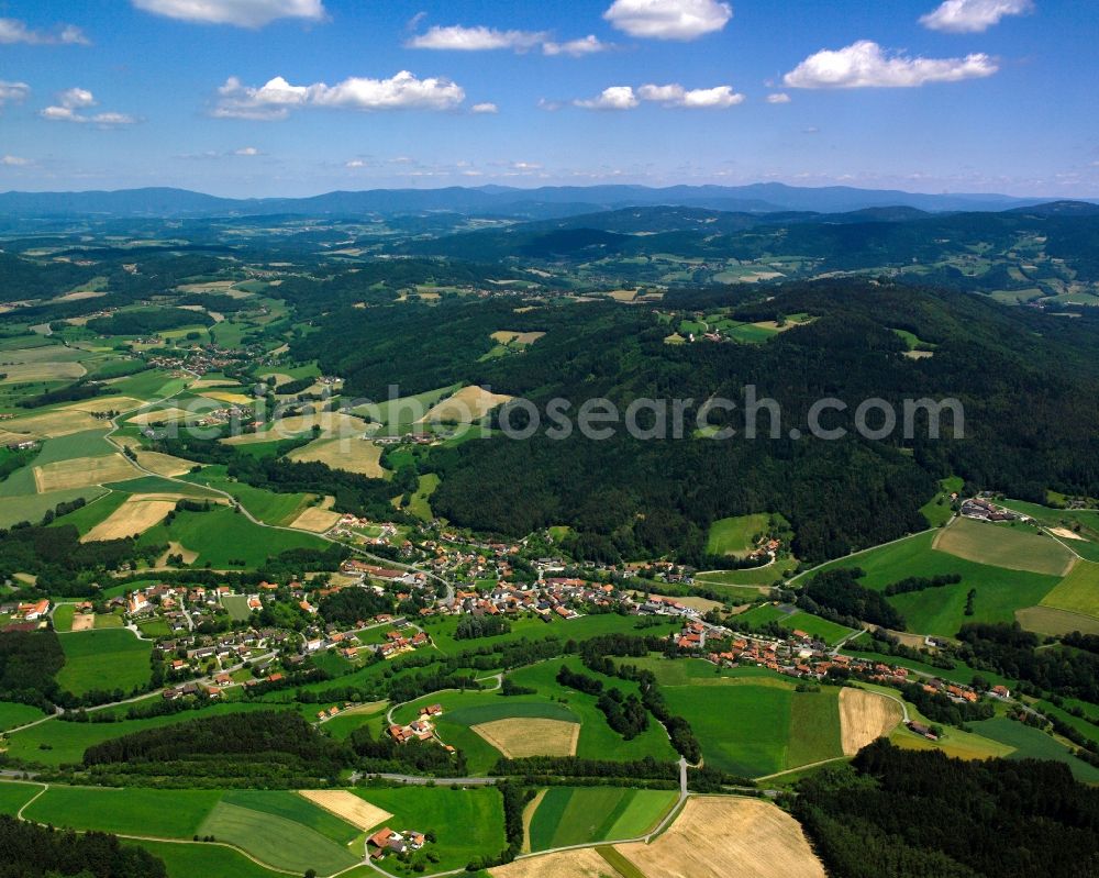 Stallwang from above - Agricultural land and field boundaries surround the settlement area of the village in Stallwang in the state Bavaria, Germany