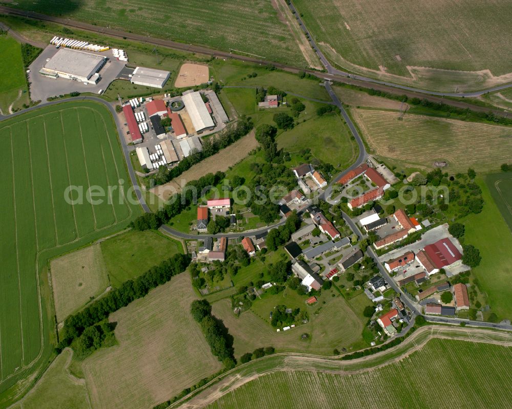 Stauda from the bird's eye view: Agricultural land and field boundaries surround the settlement area of the village in Stauda in the state Saxony, Germany