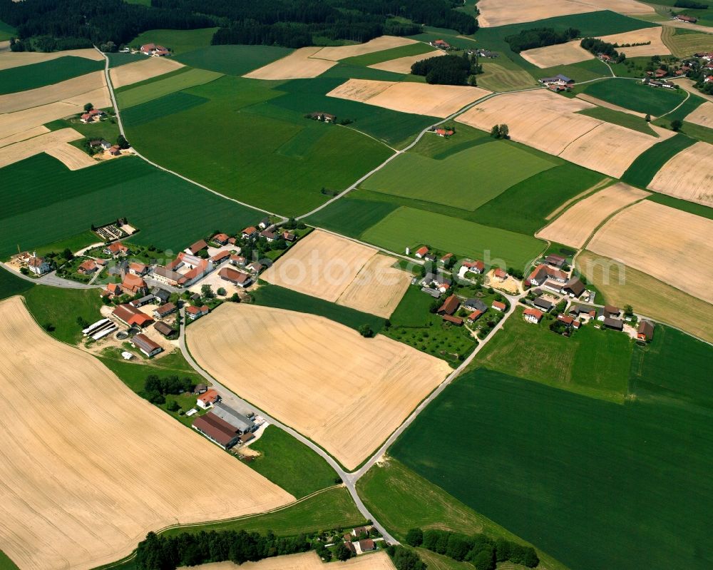 Aerial photograph Staudach - Agricultural land and field boundaries surround the settlement area of the village in Staudach in the state Bavaria, Germany