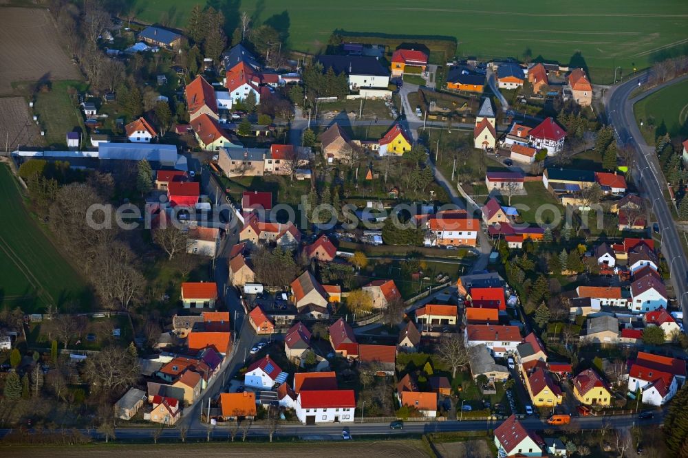 Stedten from the bird's eye view: Agricultural land and field boundaries surround the settlement area of the village in Stedten in the state Thuringia, Germany