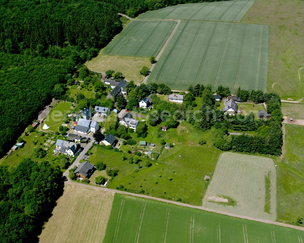 Steffenshof from above - Agricultural land and field boundaries surround the settlement area of the village in Steffenshof in the state Rhineland-Palatinate, Germany