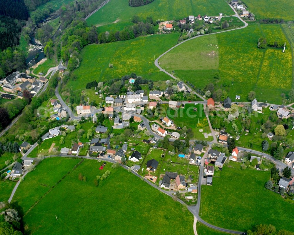 Stein from the bird's eye view: Agricultural land and field boundaries surround the settlement area of the village in Stein in the state Saxony, Germany