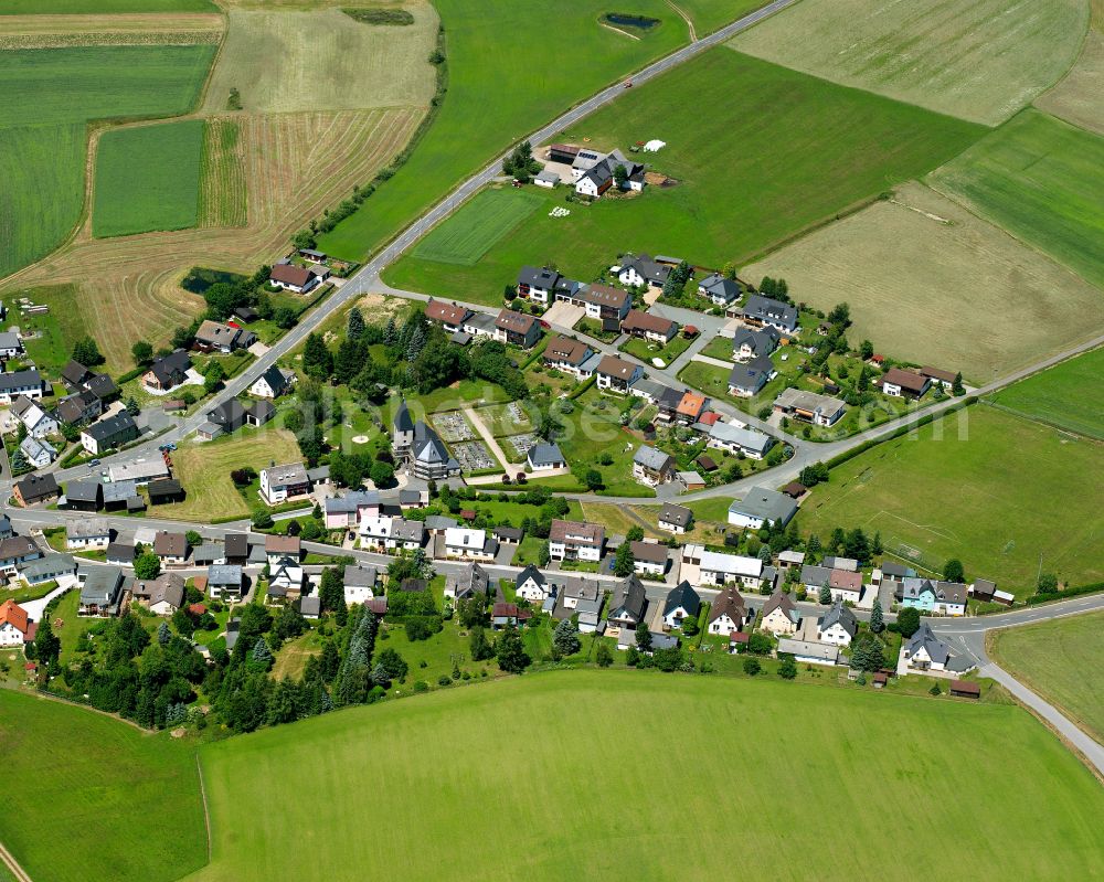 Aerial image Steinbach - Agricultural land and field boundaries surround the settlement area of the village in Steinbach in the state Bavaria, Germany