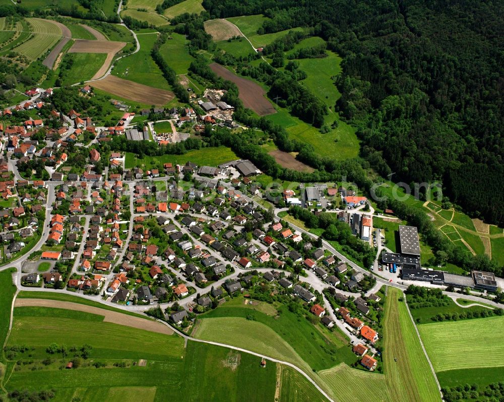Steinenberg from above - Agricultural land and field boundaries surround the settlement area of the village in Steinenberg in the state Baden-Wuerttemberg, Germany