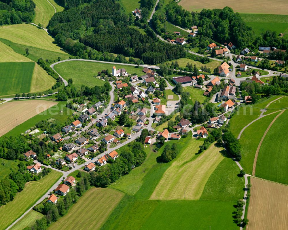 Steinhausen an der Rottum from above - Agricultural land and field boundaries surround the settlement area of the village in Steinhausen an der Rottum in the state Baden-Wuerttemberg, Germany