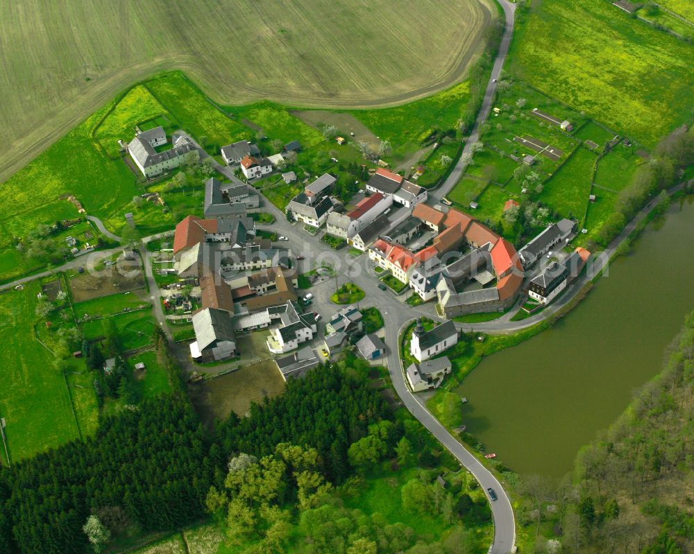 Aerial image Stelzendorf - Agricultural land and field boundaries surround the settlement area of the village in Stelzendorf in the state Thuringia, Germany