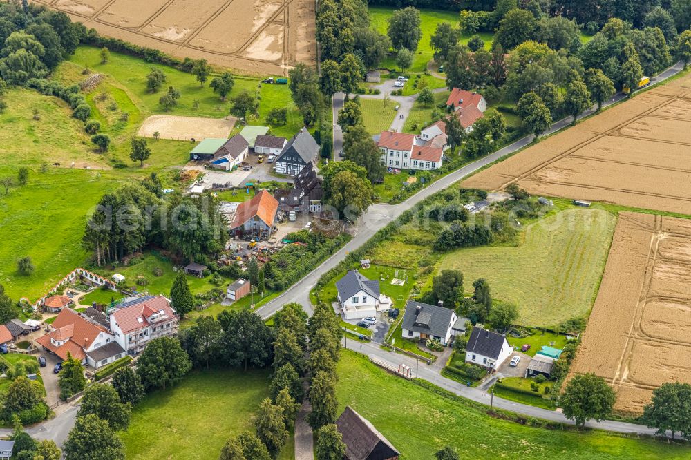 Stentrop from above - Agricultural land and field boundaries surround the settlement area of the village in Stentrop in the state North Rhine-Westphalia, Germany